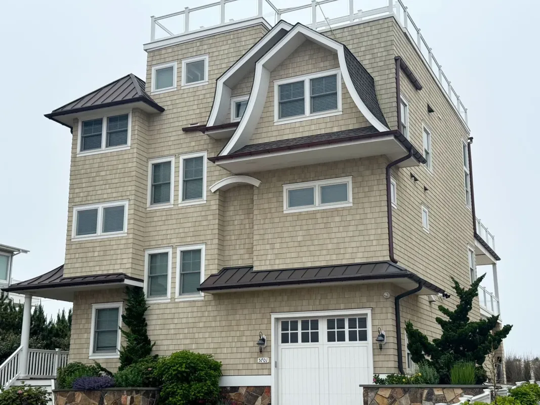 Bronze seamless gutters and downspouts on a cedar-shingle beach house in Haddonfield, NJ