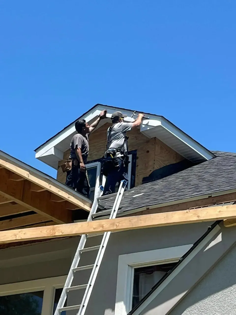 White seamless gutters, downspout, and vented soffit